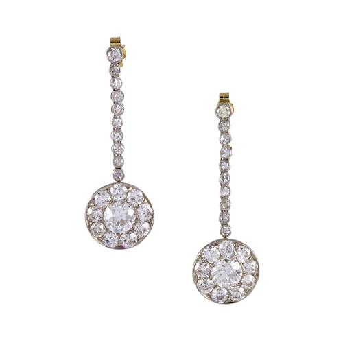 Pair of early 20th century circular diamond panel earrings, c.1915, the round clusters with principal old European brilliant cut to centre,